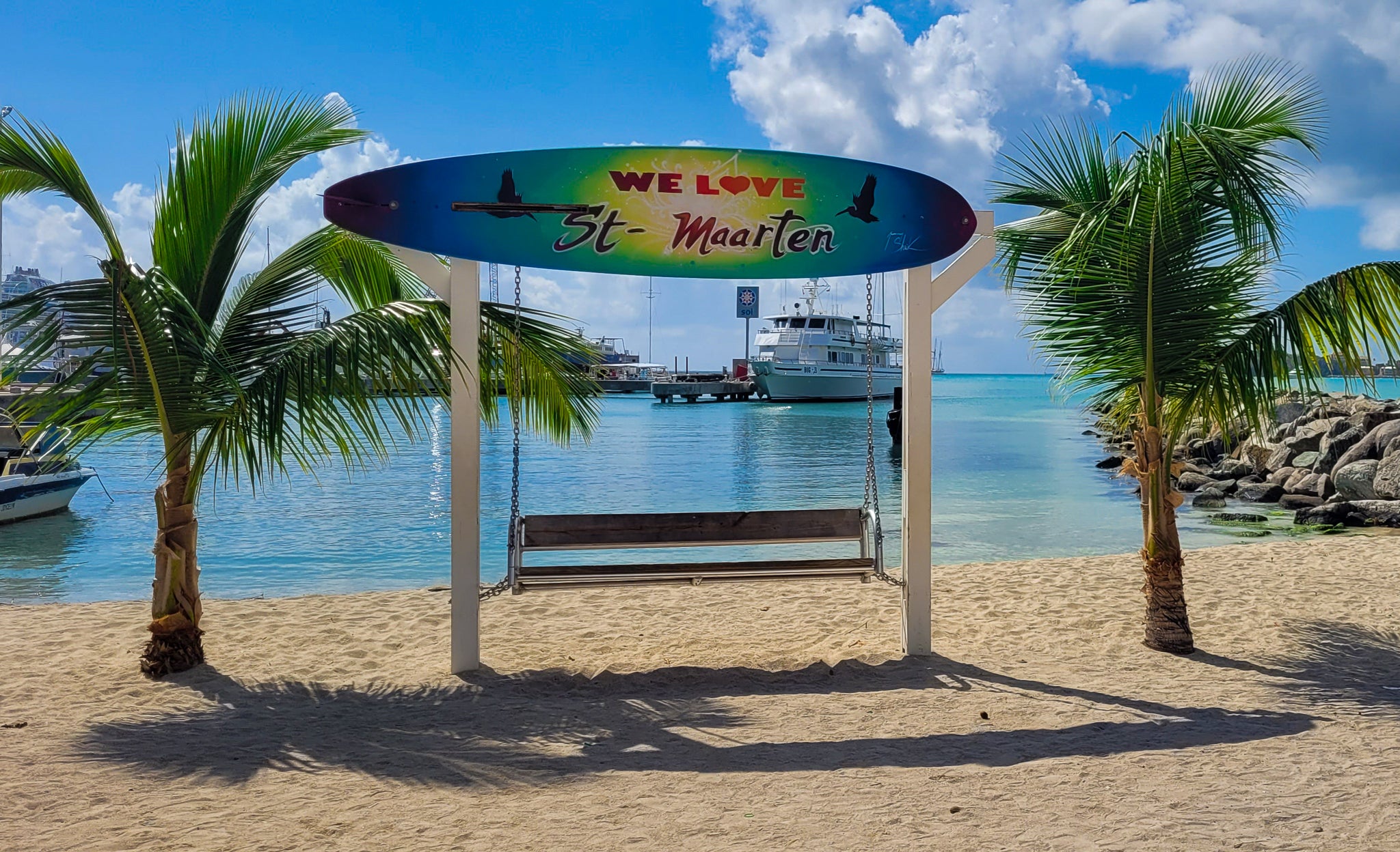 We love St-Maarten swing sign on the beach